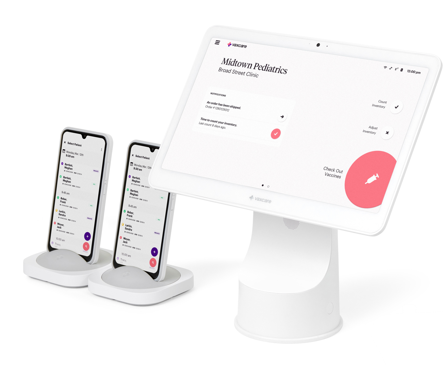 The VaxCare Hub with two VaxCare Mobile Hubs in their charging bases.